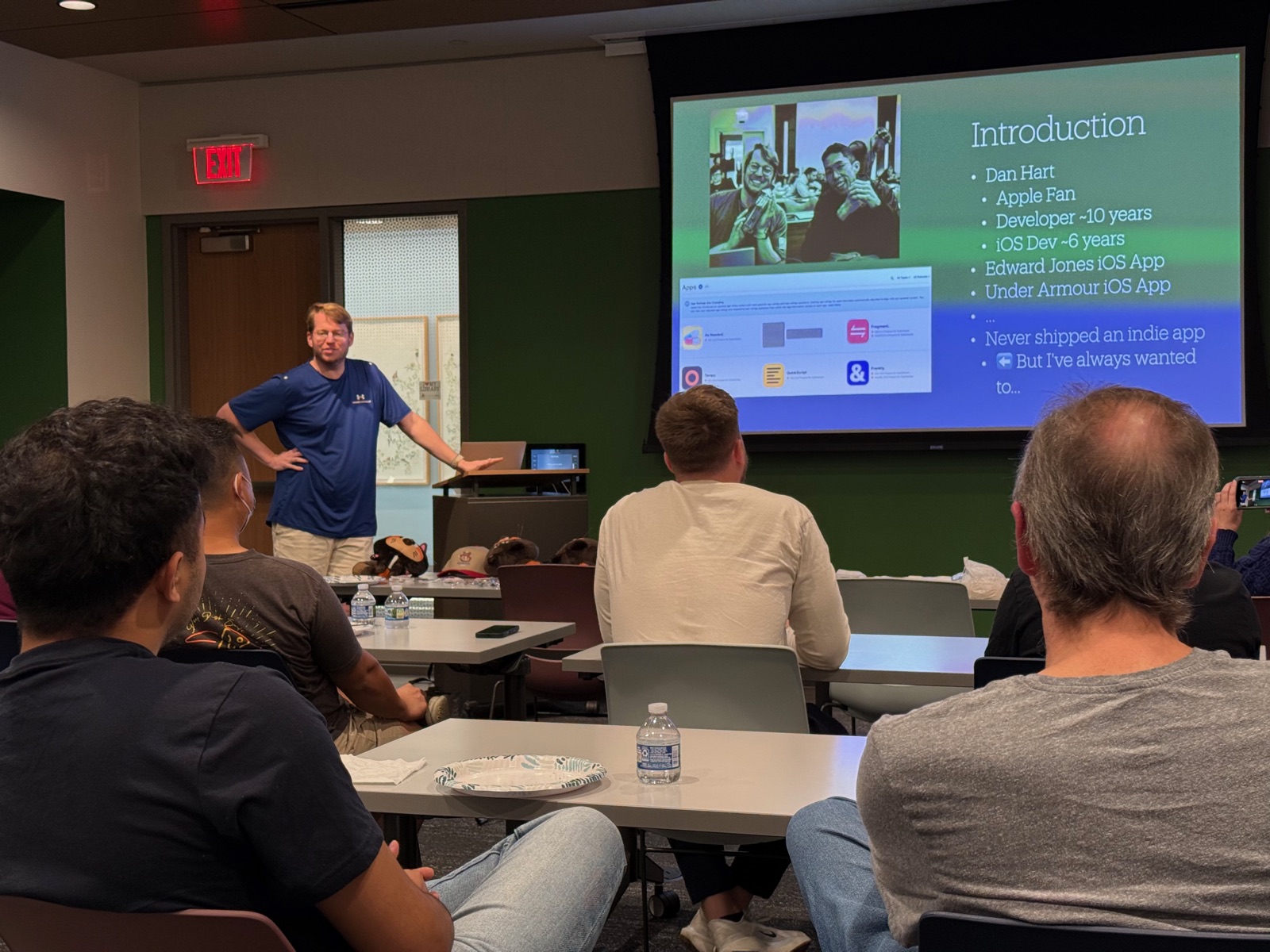 A speaker presenting at an STL Swift meetup